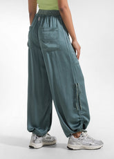 PANTALONI SATINATI MODELLO MAGNUM VERDE - TEAL GREEN | DEHA