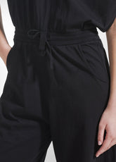 TUTA JUMPSUIT IN JERSEY CON APERTURA SUL RETRO NERO - Vestiti, Gonne e Tute | DEHA