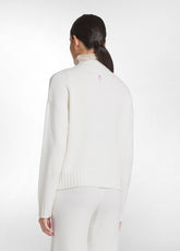 SET AUS V-AUSSCHNITT-PULLOVER UND STRICKHOSE MIT PAILLETTEN IN WEISS - | DEHA